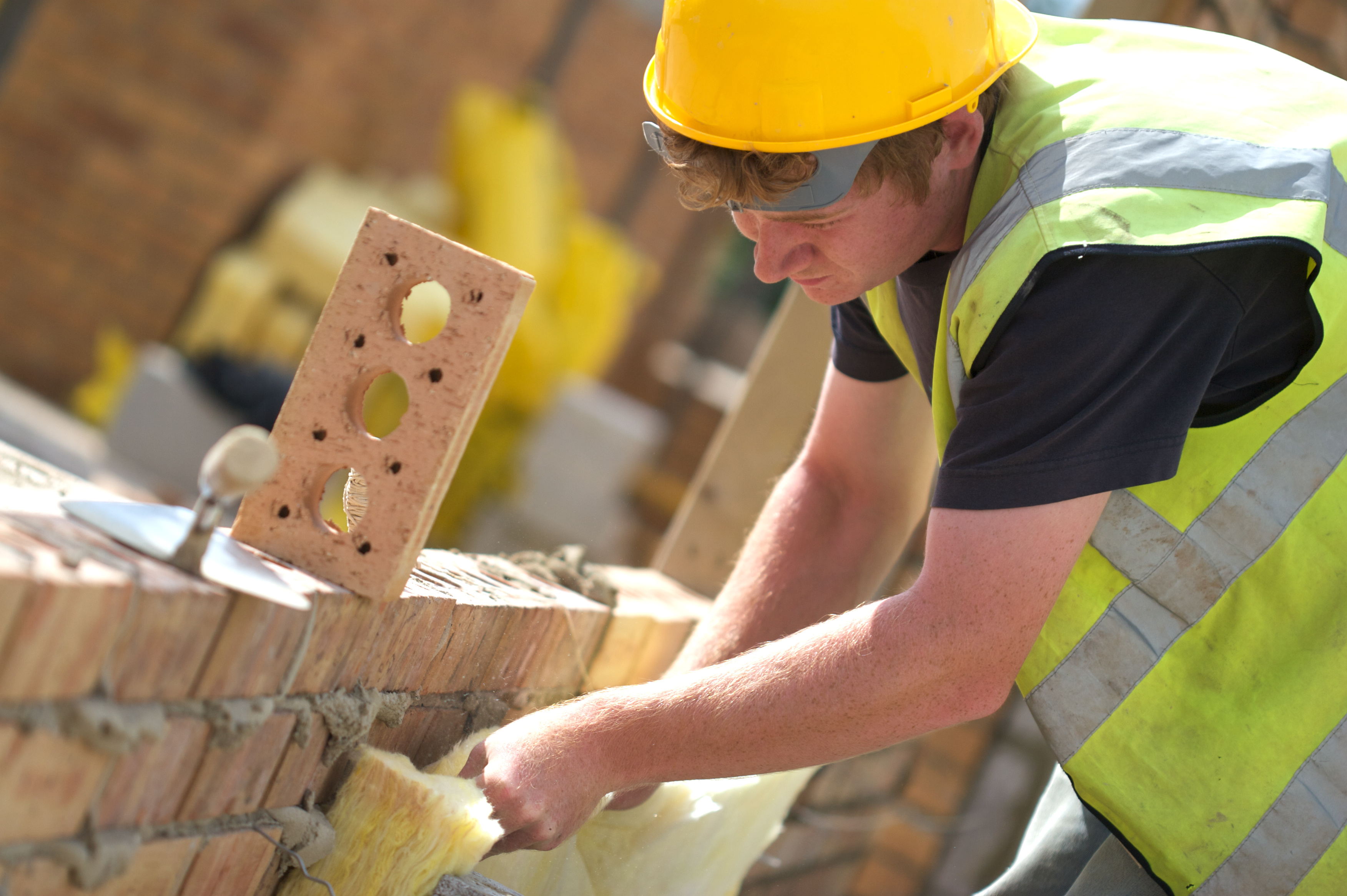 Bricklayer Working On Site